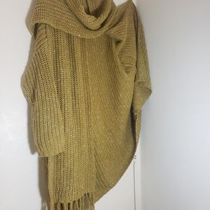 A cardigan sweater with scarf .